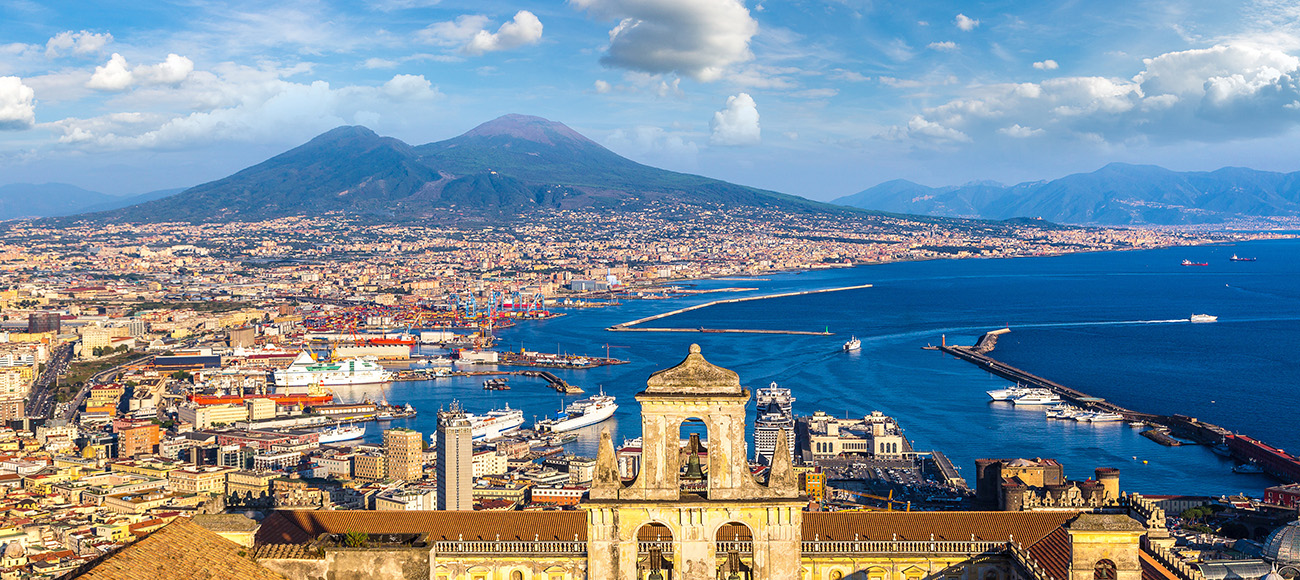 Napoli (Naples) and mount Vesuvius in the background at sunset in a summer day, Italy, Campania